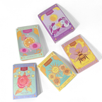 Set of colorful tarot cards with floral and nature-themed designs on a white background.