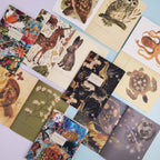 Collection of notebooks with animal and nature-themed designs on a light blue background
