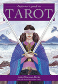 Book cover of 'Beginner's Guide to Tarot' with a illustration of a person holding swords and mountains in the background.