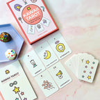 Kawaii Tarot card set with cards and box on a pink surface