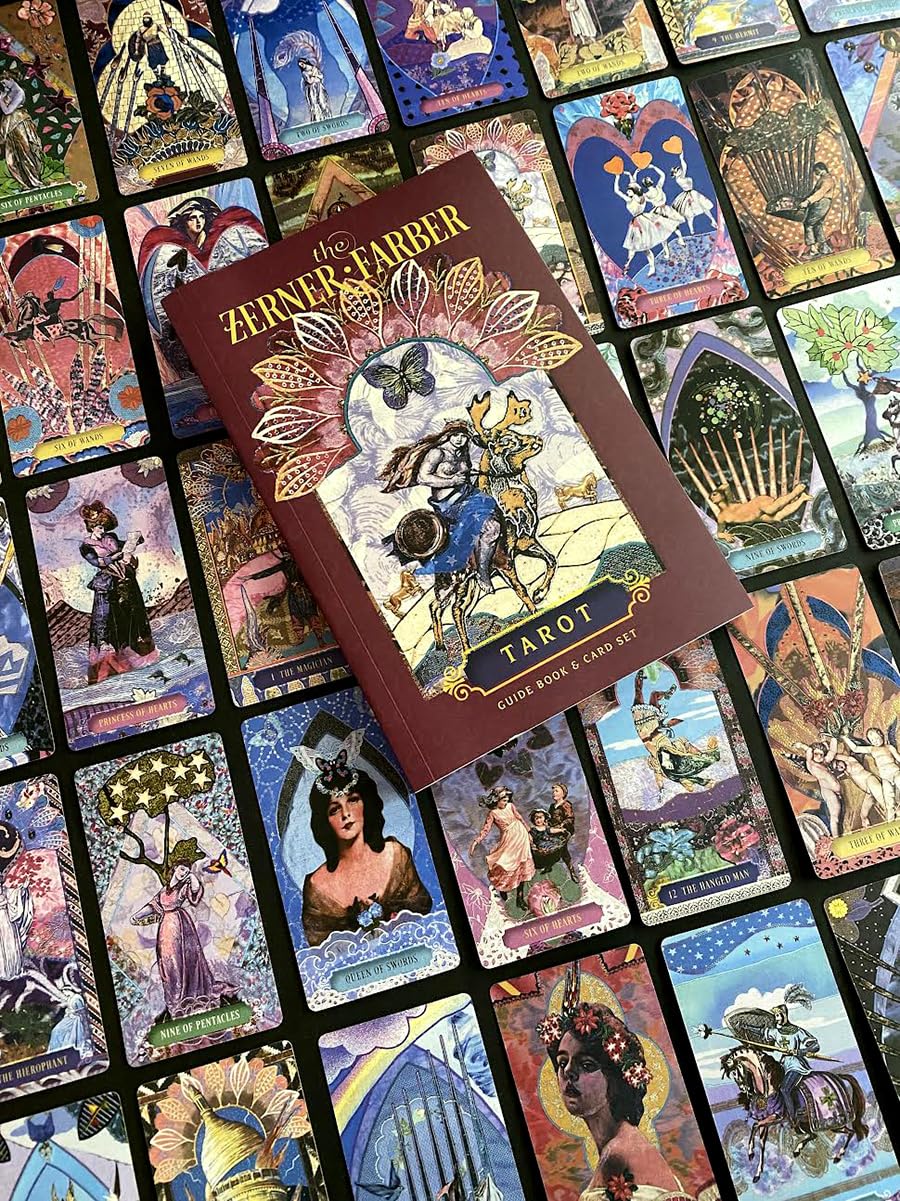 Zervos Tarot book surrounded by tarot cards with intricate artwork