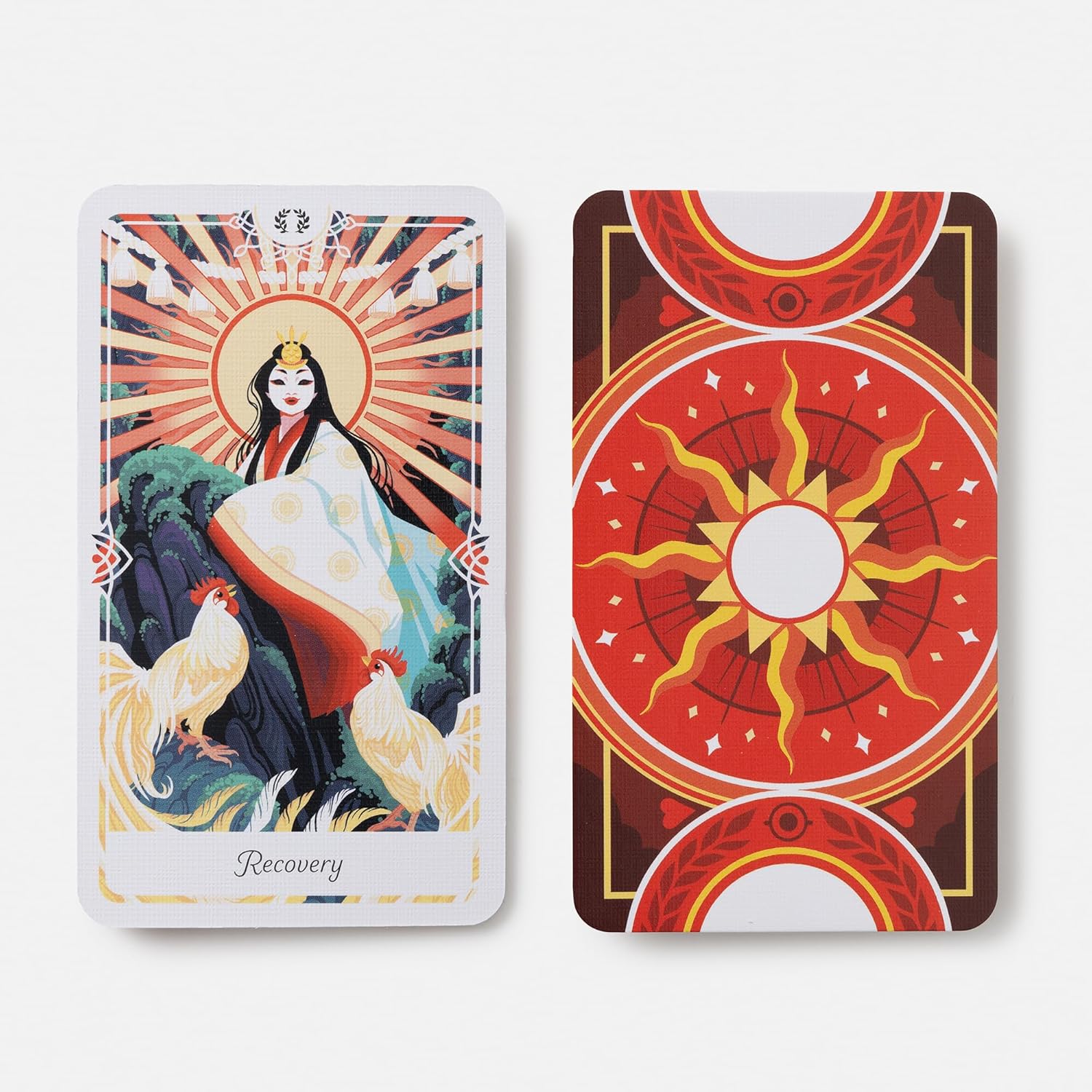 Two tarot cards with artistic designs and symbols on a white background