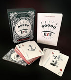 Playing cards with 'Inner Eye Oracle' packaging on a dark background