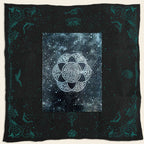 Black blanket with celestial design and white symbol in the center