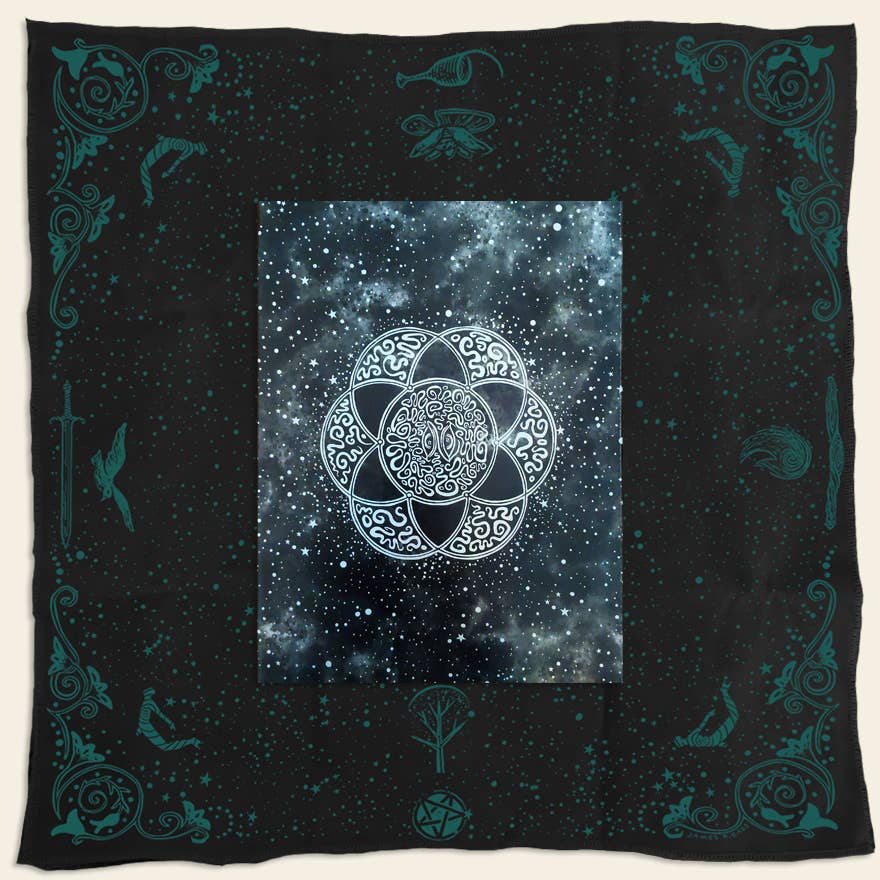 Black blanket with celestial design and white symbol in the center