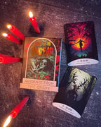 Witchy cards with red candles on a dark surface