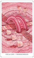 Card from a tarot deck with pink and red design, featuring cups and a rainbow.