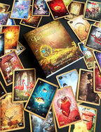 Collection of tarot cards with various designs on a dark surface