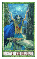 Tarot card featuring 'The High Priestess' with a woman in a blue dress standing on a rock, surrounded by nature.