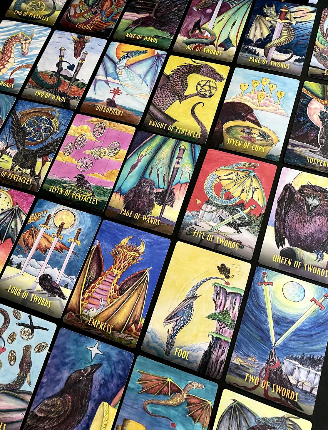 Collection of tarot cards with various designs and symbols