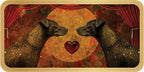 Two black dogs facing each other with a heart in the center against a red curtain background.