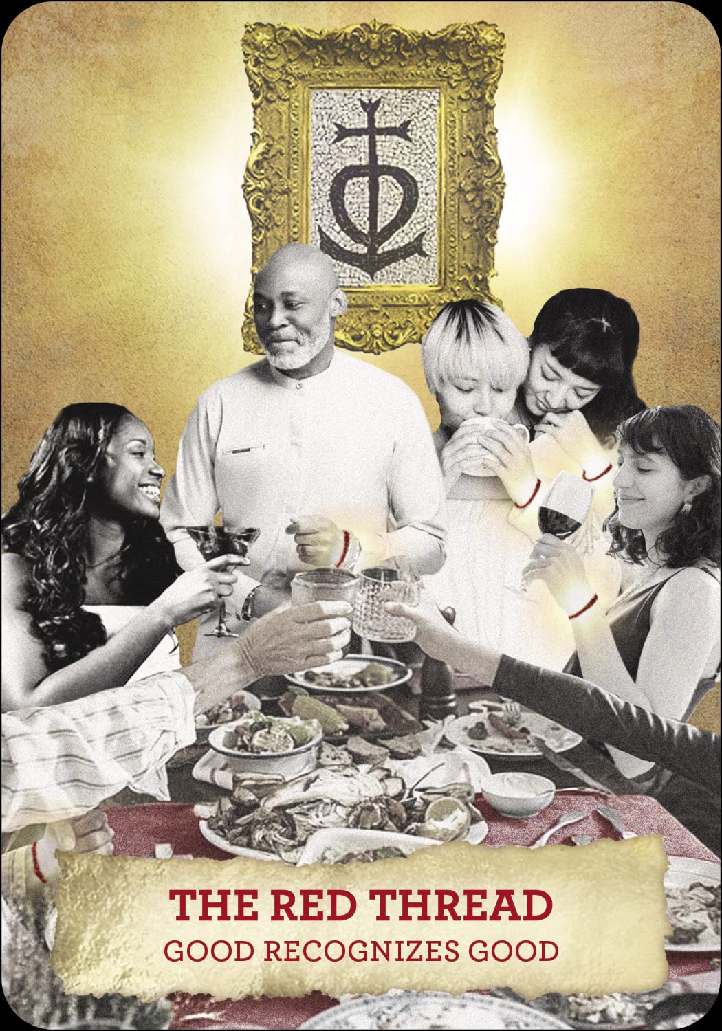 Group of people gathered around a table with a decorative frame and symbol in the background.
