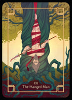 Tarot card featuring 'The Hanged Man' with a person hanging upside down, surrounded by trees and nature.