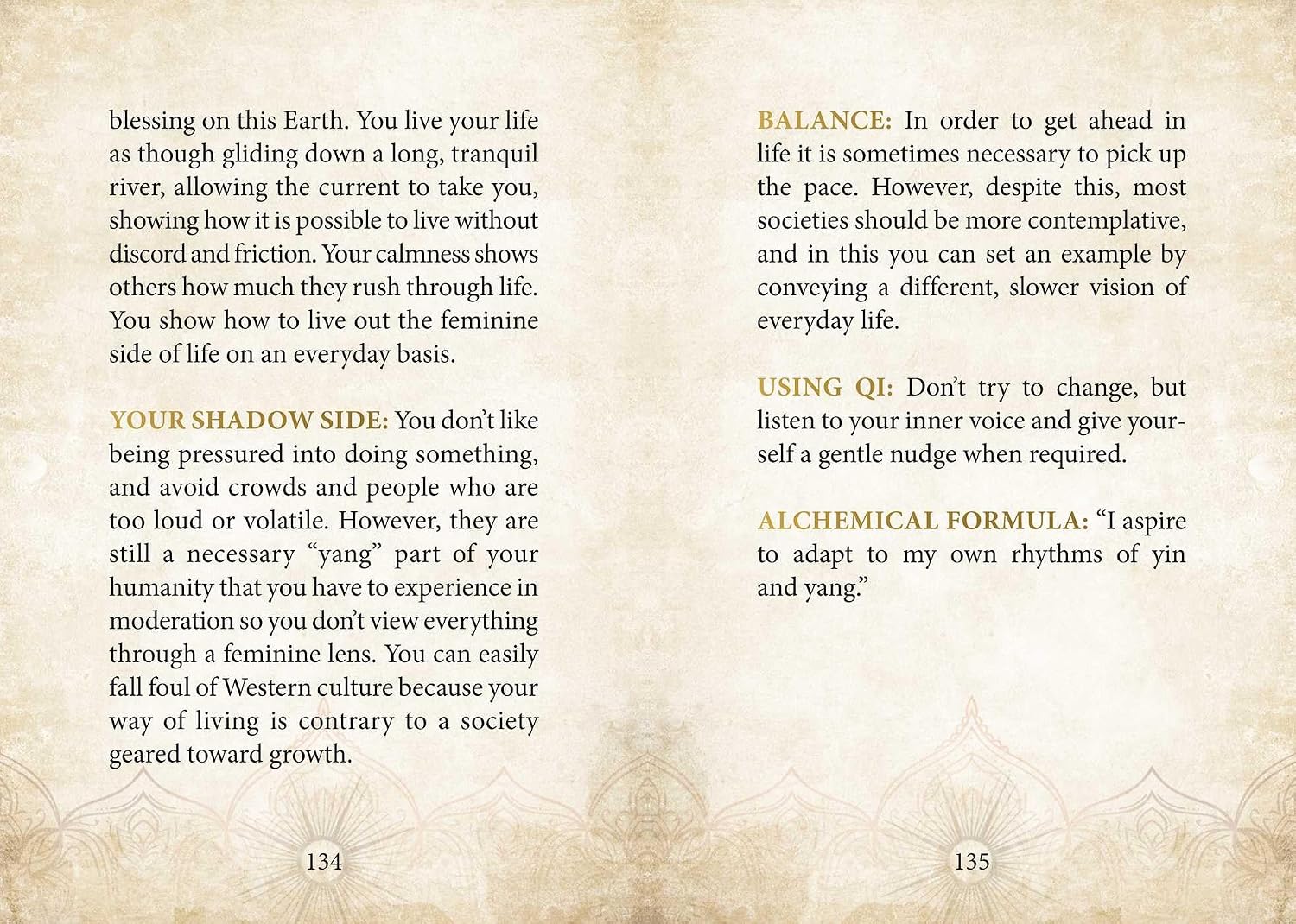 An open book showing two printed pages with black and gold text on a beige background, featuring decorative corner flourishes and page numbers 134 and 135.