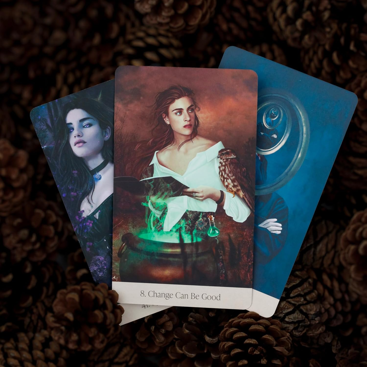 Three tarot cards on a textured surface with a mystical theme