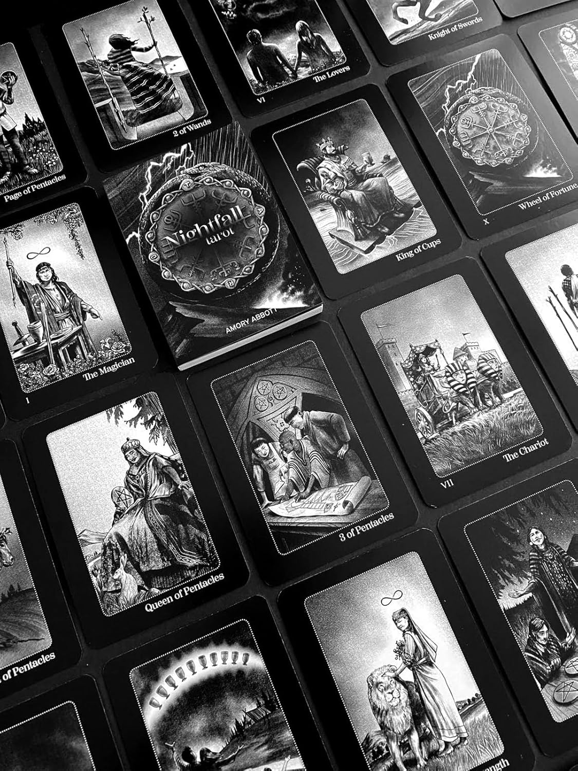 Collection of tarot cards with intricate illustrations on a black background