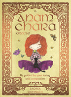 Front cover of the 'Anam Chara Oracle' card deck by Saorsa Sionnach, featuring a whimsical illustration of a girl with red hair meditating with a black cat on a purple cushion, surrounded by butterflies and stars on a beige background with an ornate brown border.
