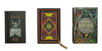Two tarot card books with decorative covers on a white background
