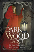 Book cover of 'Dark Wood Tarot' with a woman in a red cloak holding a lantern against a dark forest background.