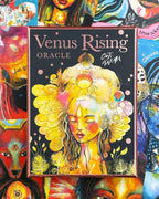 Venus Rising Oracle card deck with colorful artwork on a collage background