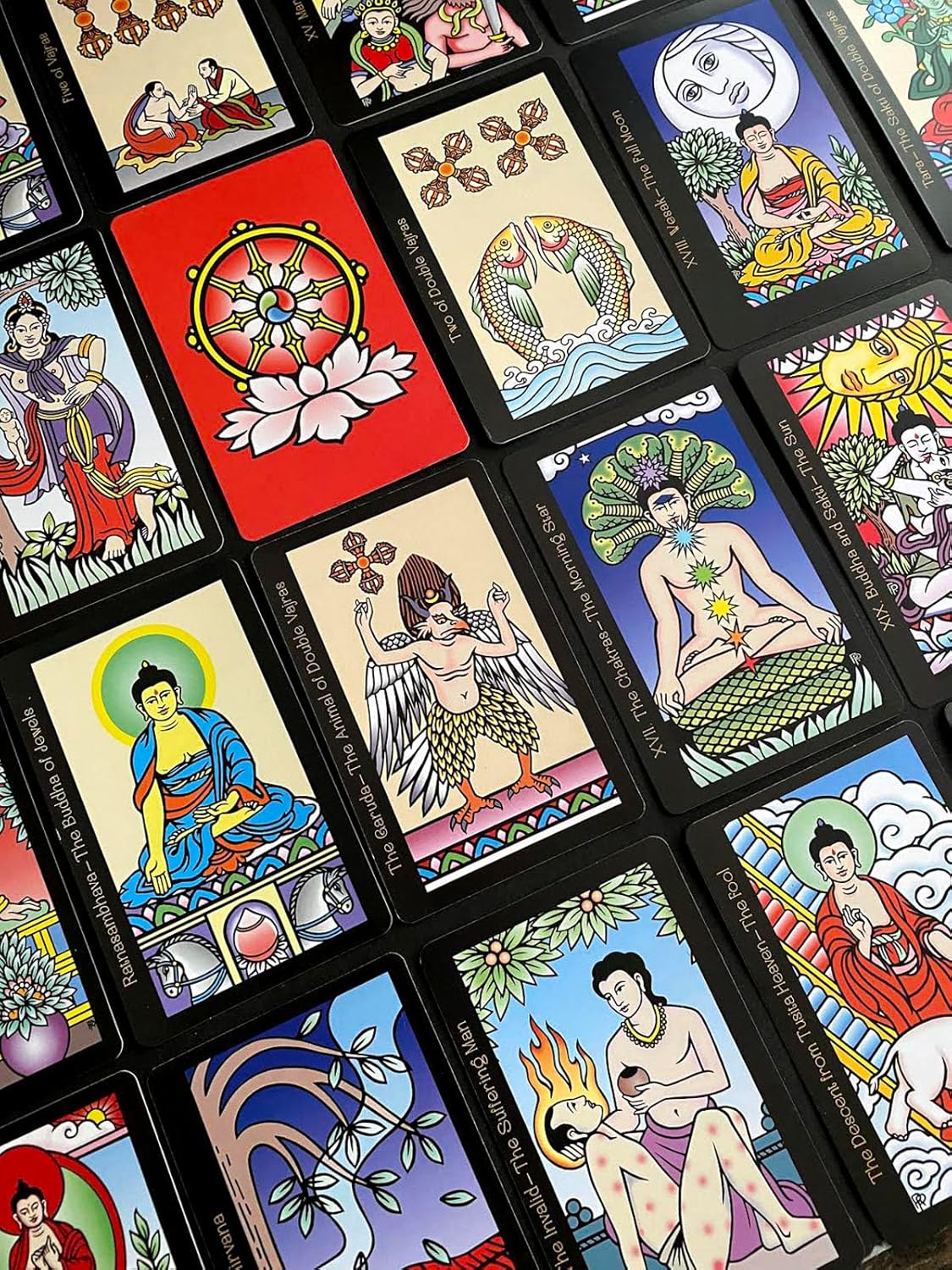 Collection of colorful tarot cards with various designs and figures.