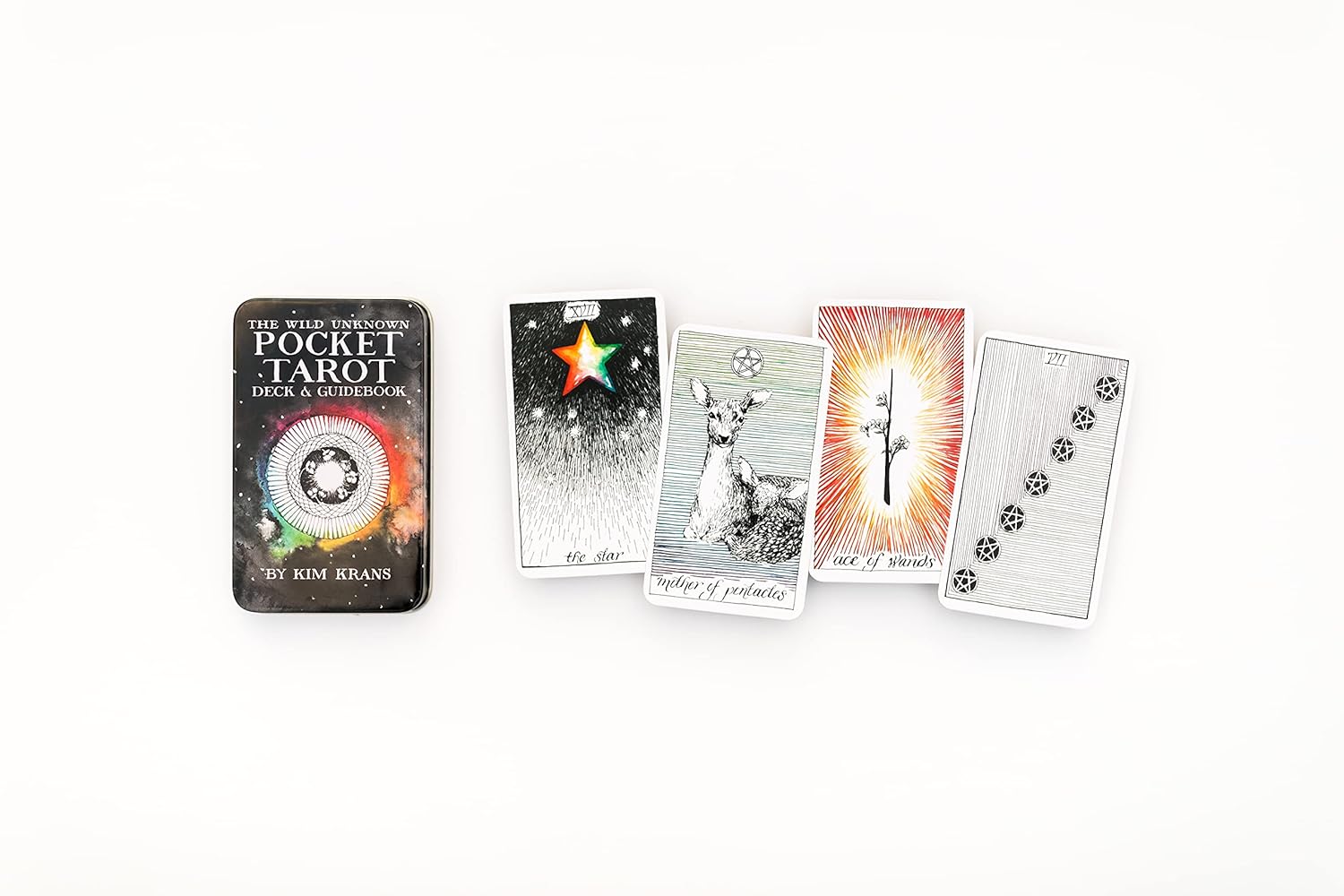 Collection of tarot cards and a book on a white background