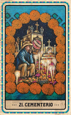 A tarot-style art print titled '21. CEMENTERIO' showing a seated man in a hat at a small altar with candles, flowers, and crosses, framed by orange marigolds on a blue and cream border.