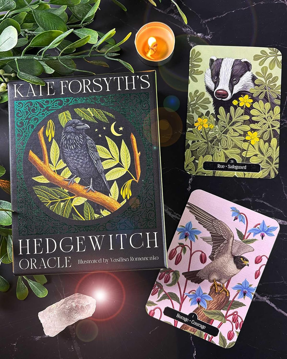 Hedge Witch Oracle book with cards and candle on a dark surface