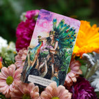 Tarot card featuring a Peacock Queen surrounded by colorful flowers