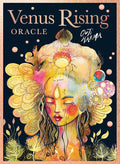 Venus Rising Oracle card deck box cover by Out Karma, featuring a colorful, psychedelic illustration of a woman's face with large decorative hair and floral elements on a dark background.