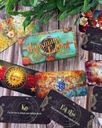 Colorful tarot cards with intricate designs on a wooden surface.
