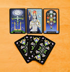 Set of tarot cards with colorful designs on a wooden surface