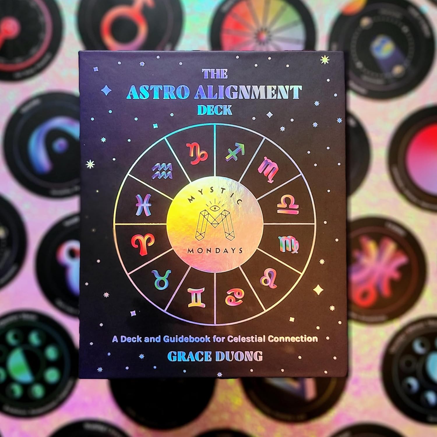 Astrology-themed product with colorful zodiac symbols on a dark background