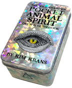 Holographic tin box with eye illustration and text 'The Wild Unknown Pocket Animal Spirit Deck & Guidebook by Kim Krans'.