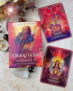 Rising Rani Oracle cards with packaging on a textured surface.