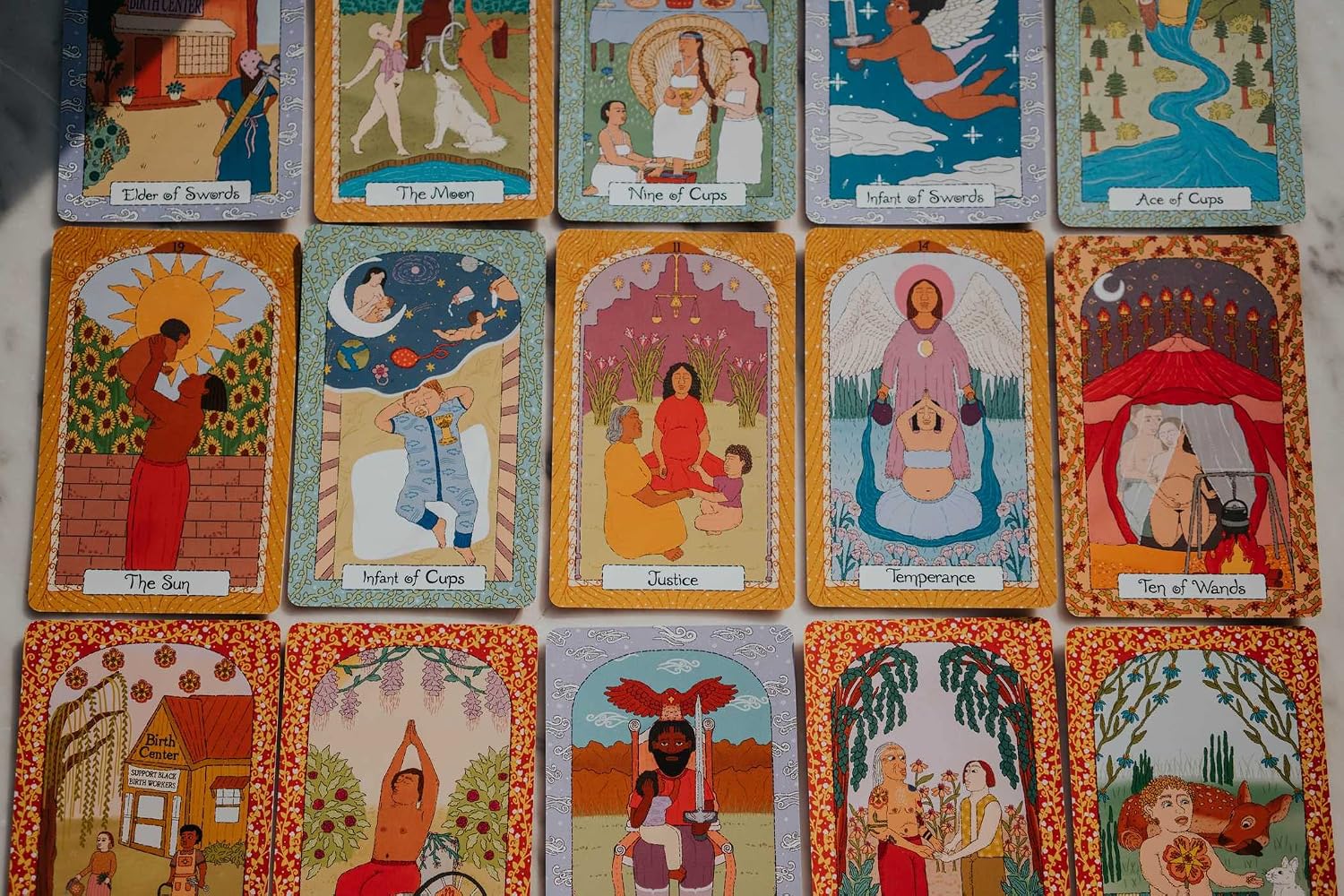 Collection of tarot cards with colorful illustrations and text