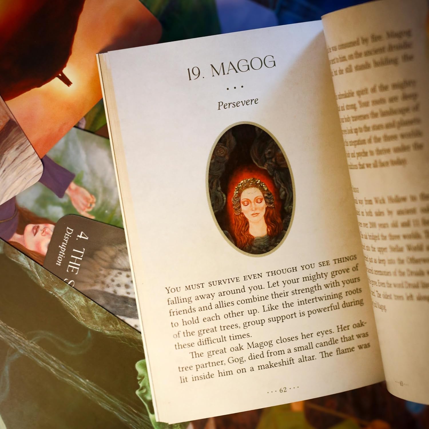Open book with a decorative page featuring a portrait of a woman with red hair, surrounded by text.