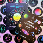 Astrology-themed card deck with colorful designs on a multicolored circular pattern background.