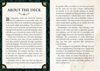 An open book spread showing a printed page titled 'ABOUT THE DECK' with two columns of black text on white paper and a decorative gold-bordered ornamental corner accent.