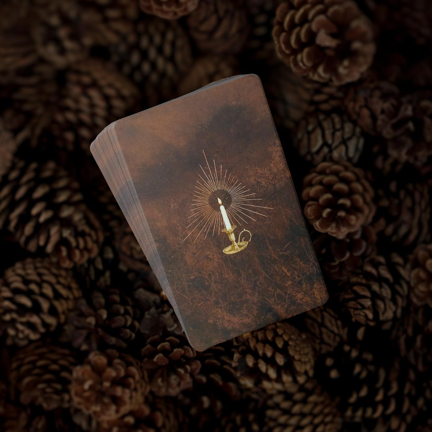 Vintage-style book with a candle illustration on a textured brown background