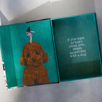 Teal box with a dog illustration and a quote on a white background