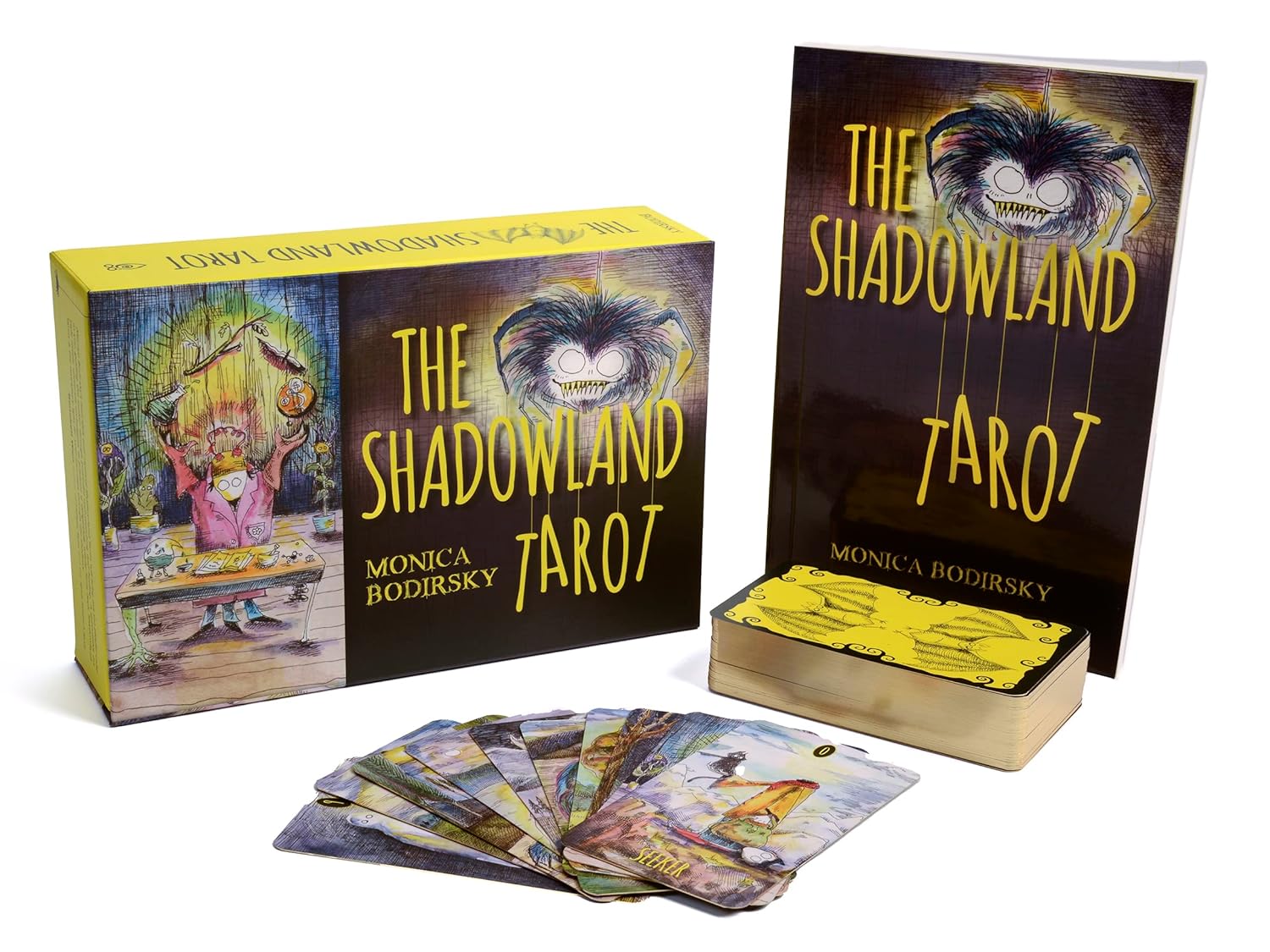 The Shadowland Tarot set with tarot cards, box, and book on a white background