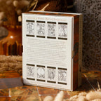 Card game box with tarot card designs on a wooden surface