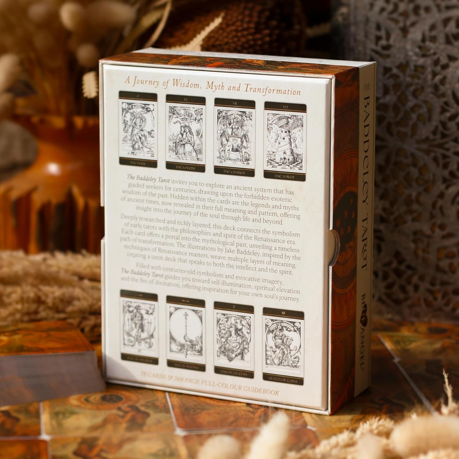 Card game box with tarot card designs on a wooden surface