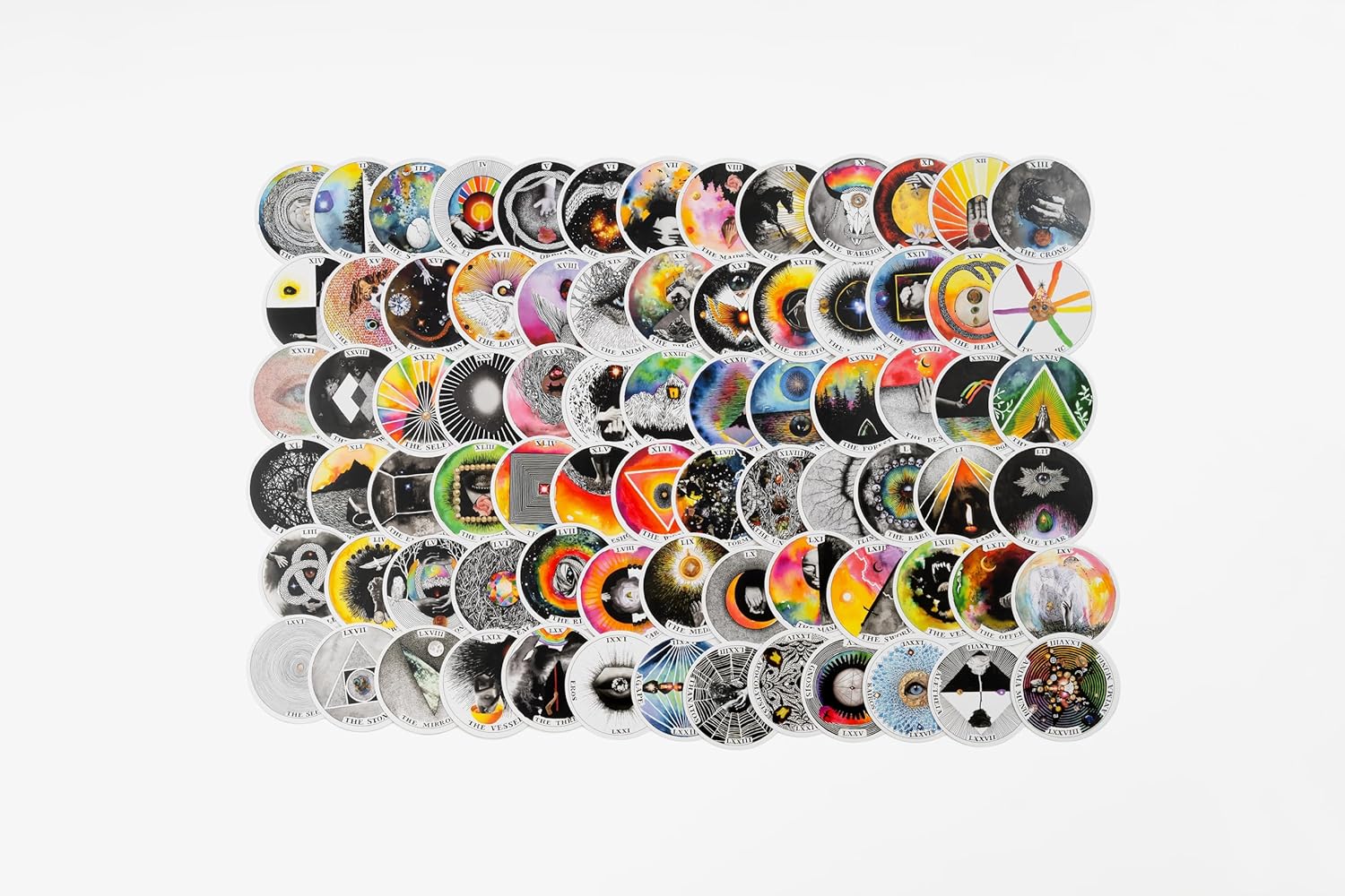 Collection of colorful vinyl records arranged in a grid pattern on a white background