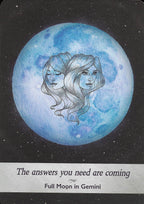 Artistic depiction of a blue moon with two faces and text 'The answers you need are coming. Full Moon in Gemini' on a dark background.