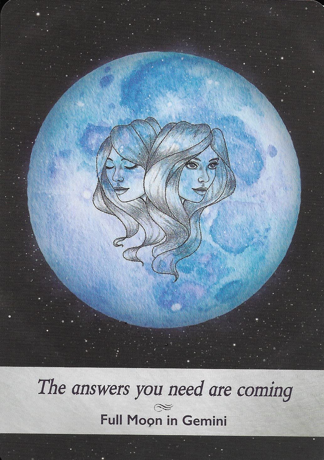 Artistic depiction of a blue moon with two faces and text 'The answers you need are coming. Full Moon in Gemini' on a dark background.