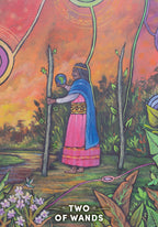 Card featuring a person holding a wand with a colorful background and 'Two of Wands' text.