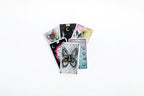 Collection of tarot cards with various designs on a white background