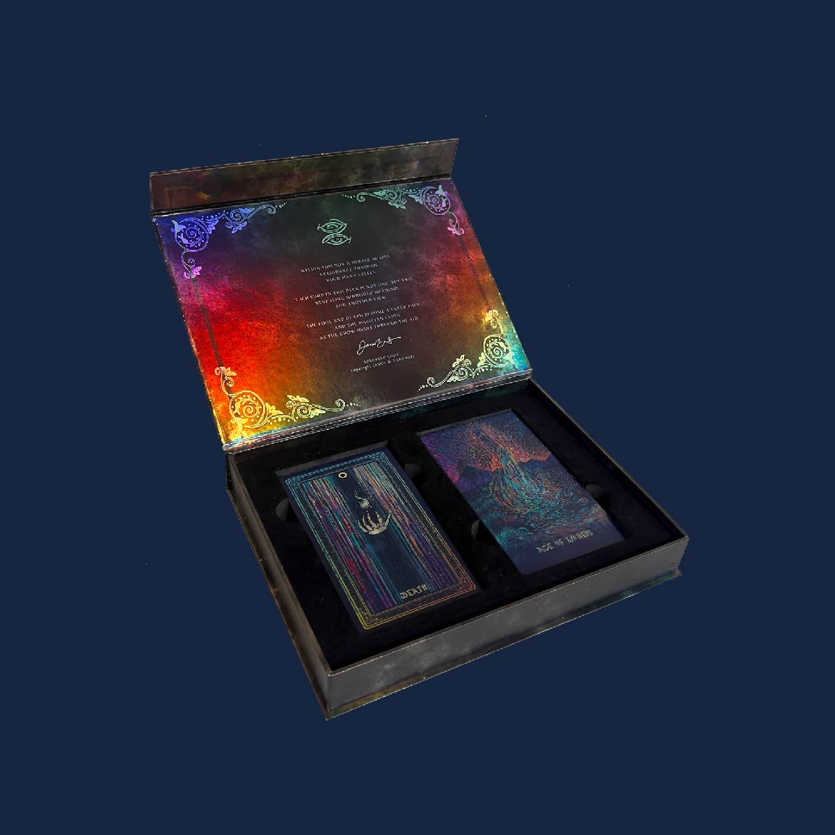 Colorful card set in an open box with a dark blue background